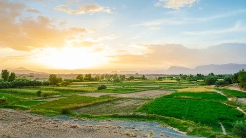 Time lapse shot of shiny sunset over green landscape. Er-Rich, Morocco. Stock Footage 114374254