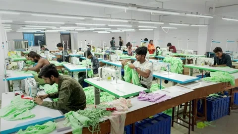 A time lapse shot of the skilled workers using stitching machine to sew Stock Footage 313030213