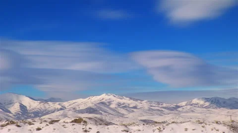 Time-lapse shot of snow-capped mountains in Utah Stock Footage 52328313