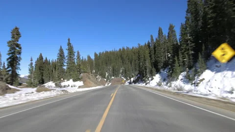 Time Lapse Shot Of Snow Covered Mountains Seen Through Vehicle On Sunny Day - Stock Footage 160314176