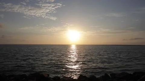 A time lapse shot of the sun rising over the ocean in India Stock Footage 167451360