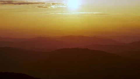 Time-lapse shot of sunset over a hilly horizon, timelapse 4k Video stock 250266386