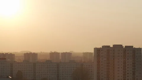 Time lapse shot of the sunset. The sun hides behind the buildings 4k 50fps Stock-Footage 105967574