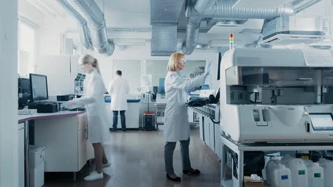 Time Lapse Shot of Team of Research Scientists Working On Computer Stock Footage 96744755