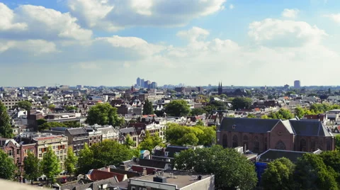 Time-lapse shot from tower overlooking rooftops in Amerstam Stock Footage 52265128