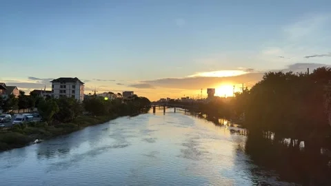 Time-lapse shot of the twilight sky and clouds in sunset time above the canal. Stock Footage 210554233