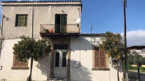 Time Lapse Shot of Very Old House with Two Orange Trees Outside in Nicosia Stock-Footage 101063275