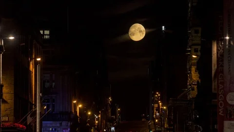 A time lapse showing the moon setting over St Vincent Street in Glasgow. Stock Footage 90754411