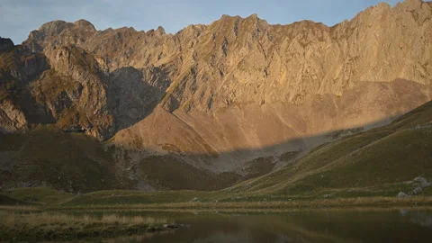 Time lapse showing play of light and shadows on a remote mountain lake Stock Footage 252622430