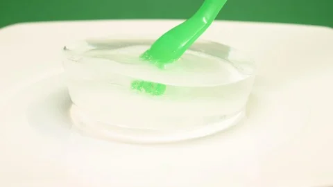 Time-lapse that shows how ice cubes melt with a fork Video stock 115105946