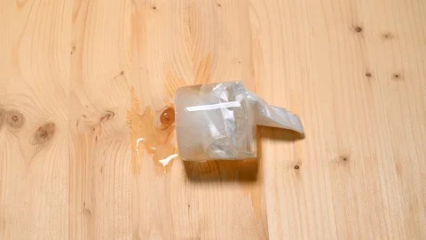 Time-lapse that shows how ice cubes melt with plastic inside Stock Footage 115445659