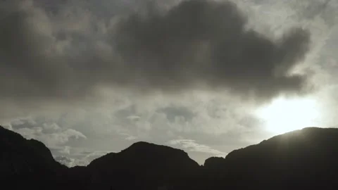 Time-Lapse Silhouette Mountain with moving dark cloudy on sky Stock Footage 153505145