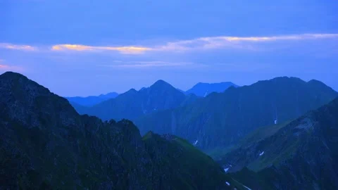 Time lapse of a Silhouetted blue mountains and horizon at Fagaras mountains Stock Footage 201423301