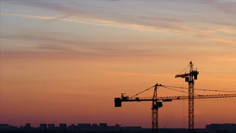 Time lapse. Silhouettes of working cranes on the red colored sky background Stock Footage 250201089