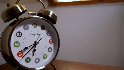 Time-Lapse of a Silver Antique Clock on a Table by an Open Window Stock Footage 337193375