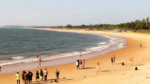 Time lapse Sinquerim Beach in Goa with tourists enjoying watersport activities Stock Footage 169813192
