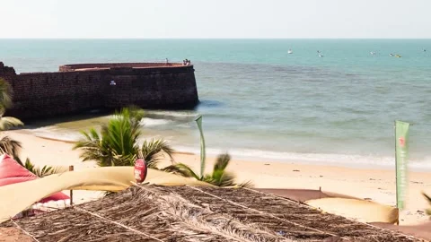 Time lapse Sinquerim Beach in Goa with tourists enjoying watersport activities Stock Footage 169813200