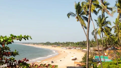 Time lapse Sinquerim Beach in Goa with tourists enjoying watersport activities Stock Footage 169813201
