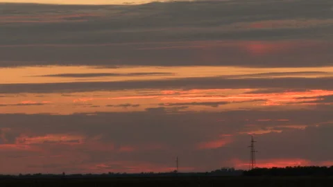 Time lapse of a the sky and clouds burning on a beautiful sunset Stock-Footage 138631855