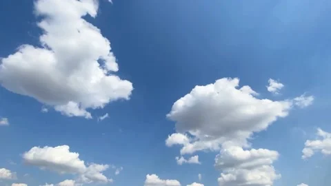 Time lapse of sky in the day time, blue sky white clouds background. Stock Footage 169011172