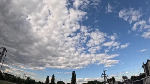 Time lapse of sky, floating clouds above countryside or town Stock Footage 307673582