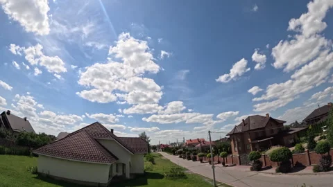 Time lapse of sky, floating clouds above countryside or town Stock Footage 313505799