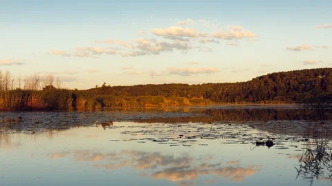 Time lapse. The sky is mirrored in water. Bright and different colors. Stock Footage 116598761