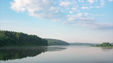 Time lapse sky over a forest lake just after sunrise. Morning fog leaves. Stock Footage 158182309