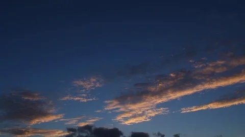 A TIME LAPSE of a sky at sunset from day to night with beautiful clouds. Stock Footage 105953288