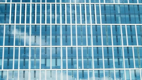 Time lapse of a skyscraper city building, blue sky and glass mirror facades. Stock Footage 229026902