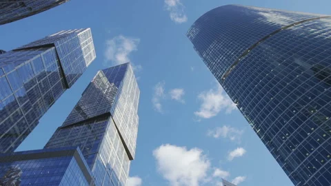 Time-lapse skyscraper in the city under floating clouds Video stock 104603756