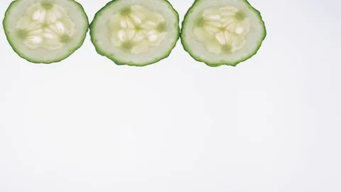 Time lapse with slices of cucumber Stock Footage 70033517