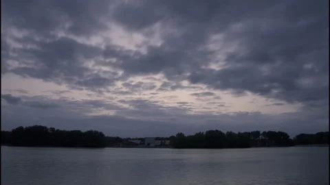 Time-lapse of Sloterplas with Moving Clouds and Reflections Stock Footage 310937343