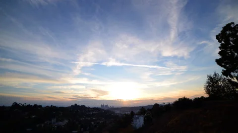 Time Lapse of Slow Moving Clouds over Downtown LA at Sunset -Tilt Up- Stock Footage 58863384