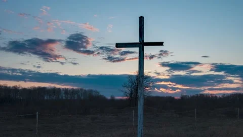 Time-lapse of slow moving sunset clouds with a large white Christian Stock Footage 131566388