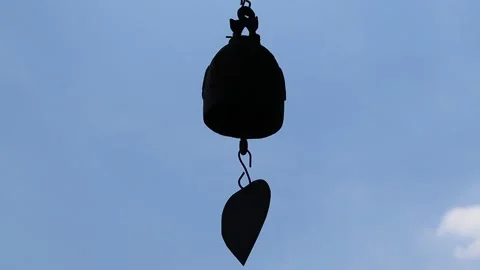 Time lapse, small bell hanging from the wind blowing Stock Footage 139258118