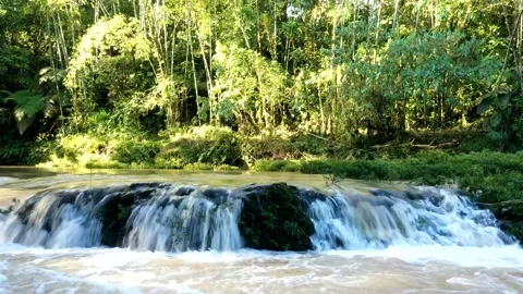 Time lapse of a small cascade showing the brown water running quickly with Video stock 142748591