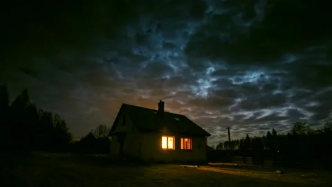 Time lapse with small house in night forest under cloudy sky with moon. Stock Footage 154424954