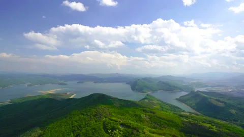 Time-lapse of a small island, blue sky and clouds Stockbeeldmateriaal 208090394