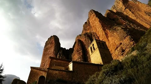 Time lapse of a small monastery in the village against the backdrop of cliffs Stock Footage 48026725