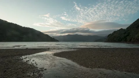 Time-lapse of a small stream running over the beach in New Zealand. Stock Footage 146190697