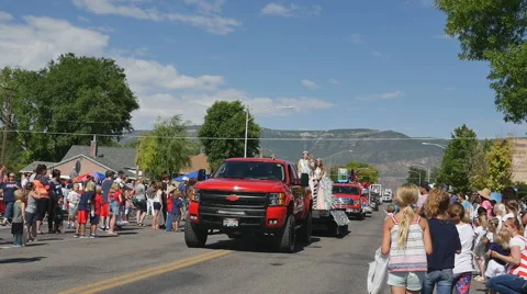 Time lapse-Small town 4th of July parade throwing candy to kids Stock Footage 64894180