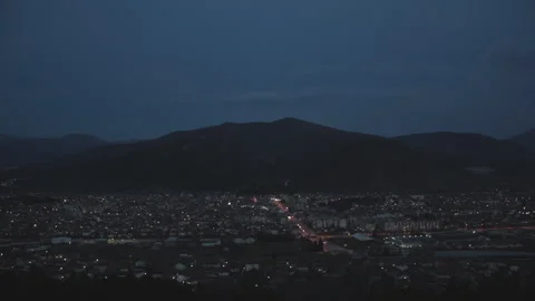 Time lapse of small town going into the night Stock Footage 147551485