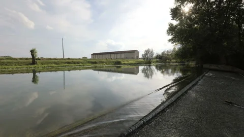 Time lapse from a small waterfall with clouds dancing in the sky Видео 138483268