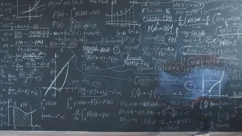 Time lapse of smart little boy writing maths formulas on chalkboard wall focused Stock Footage 281147411