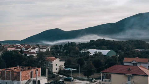 Time lapse smoke from the fire spreads through the valley Stock Footage 98308157