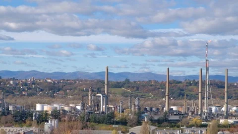 Time lapse of smoke from many chimneys from an oil refinery in France Stock Footage 99770593