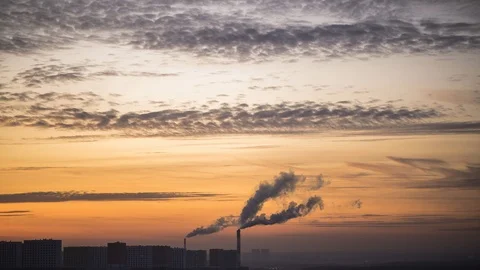 Time lapse of smoking pipe on winter sunset city background.  Landscape Stock-Footage 121441994
