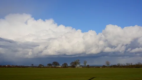 Time lapse of snow clouds and falling snow on hills york yorkshire uk Stock Footage 90374957
