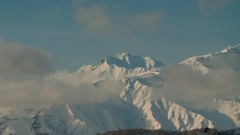 Time lapse of snow covered mountains of Hakuba valley Nagano Japan with clouds Stock Footage 123689308